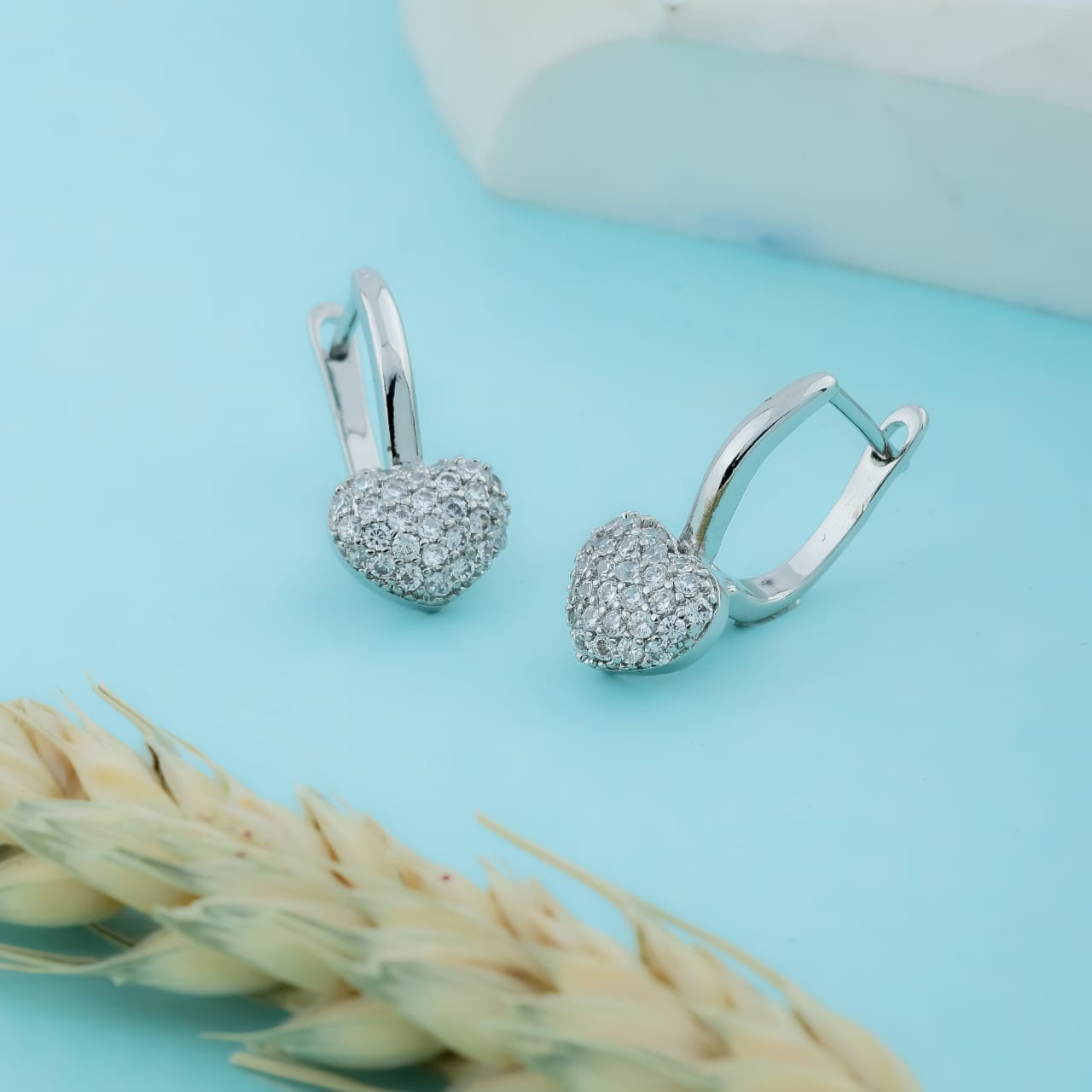 Fancy Silver Dangling Earrings With Heart Relief - Siyerajewels.com